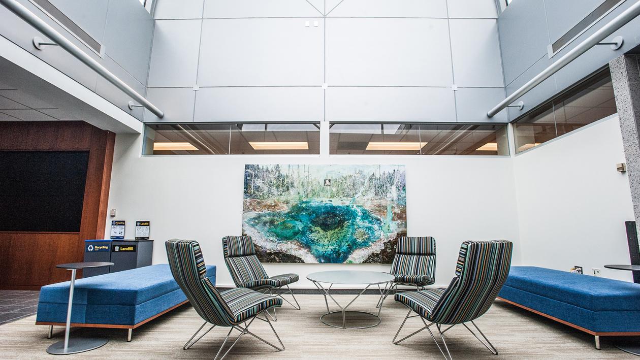 Lobby with sitting area and art with skylight